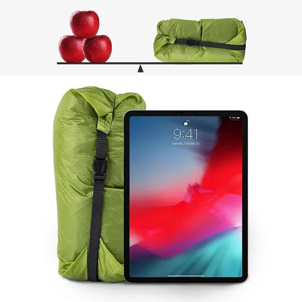 Night Cat ultralight tent in compact green carry bag, shown next to an iPad and apples for size and weight comparison.