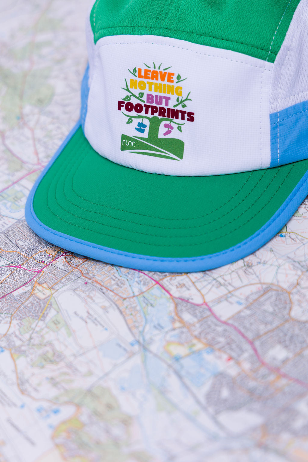 Runr Leave Nothing But Footprints Trails hat worn outdoors