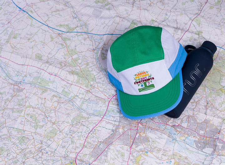 Runr Leave Nothing But Footprints Trails hat - side view while running