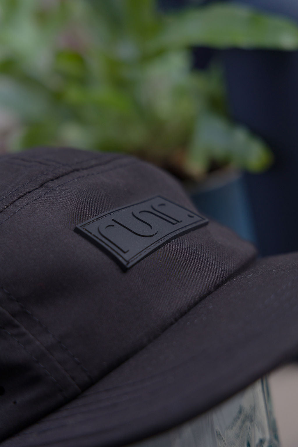 Runr Milan Blackout running hat worn on a run