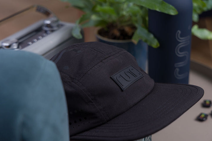 Runr Milan Blackout running hat worn outdoors