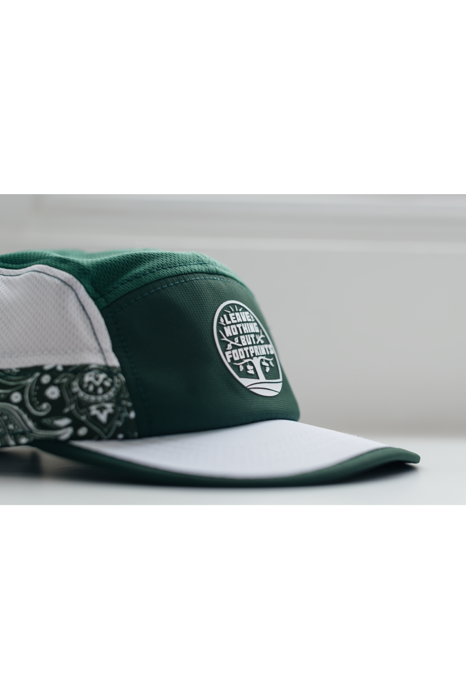 Runr Leave Nothing But Footprints running hat - under-peak view