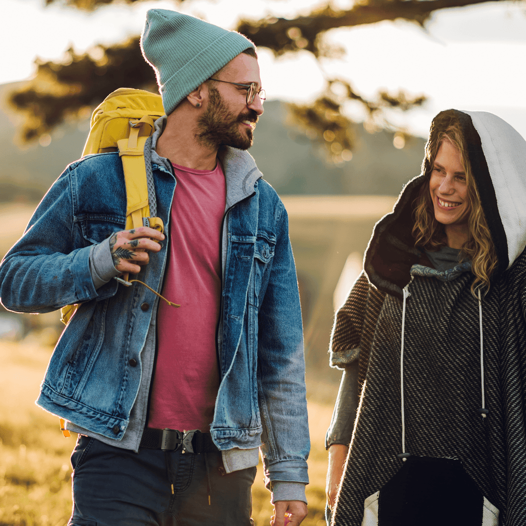 Couple walking outdoors, man wearing the HikeWare tactical belt with jeans