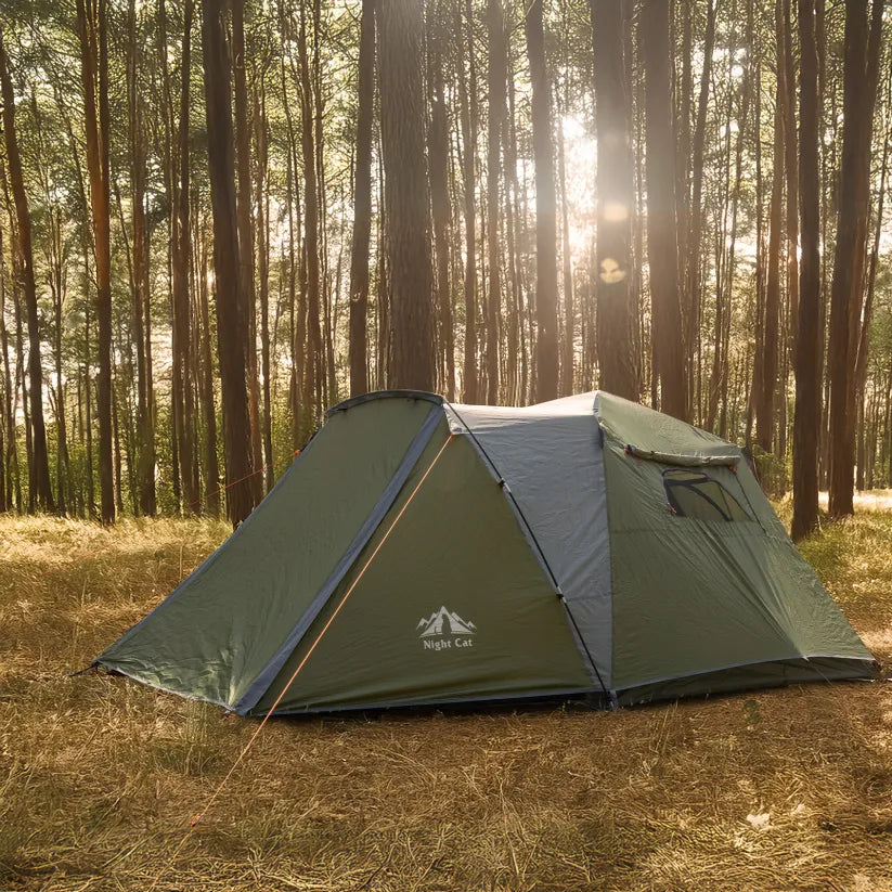 Night Cat pop-up cabin tent pitched in a pine forest