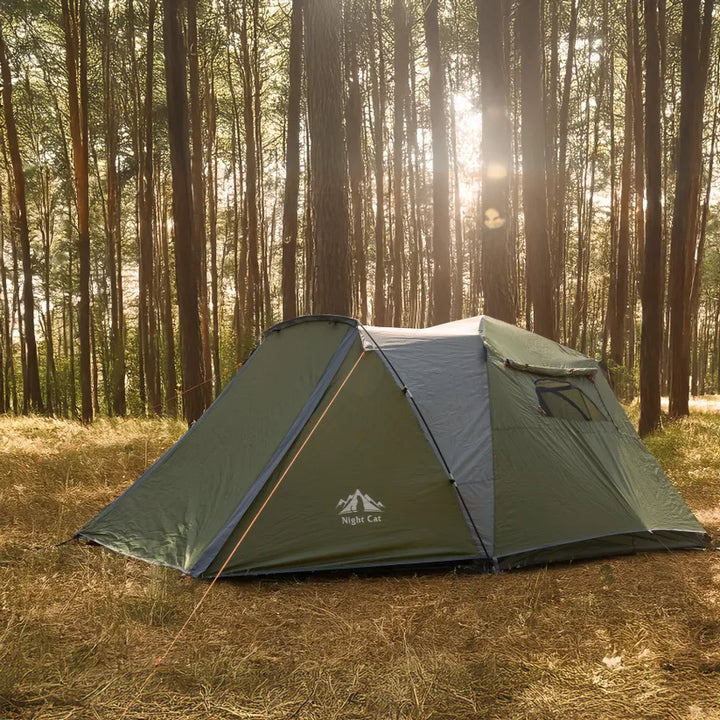 Night Cat pop-up cabin tent pitched in a pine forest