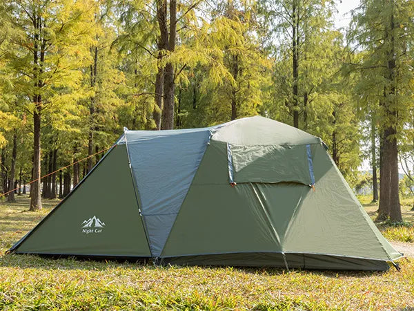 Night Cat pop-up cabin tent in green pitched in woodland, side view