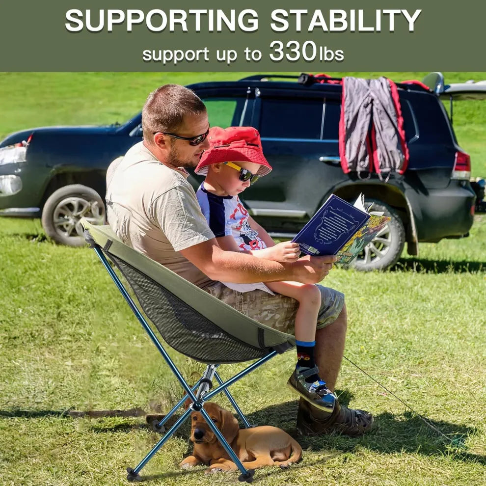 Night Cat camping chair supporting up to 330 lbs, shown with a man and child sitting comfortably while reading outdoors, illustrating the chair's stability and strength for family camping.