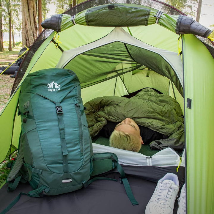 Inside view of Night Cat 1-person tent with sleeping camper and backpack, showing interior space