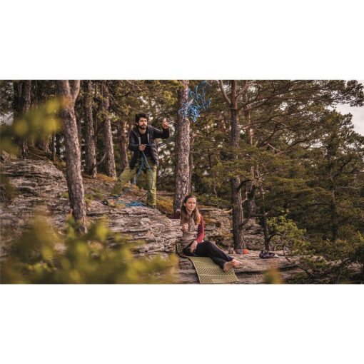 Climbers resting on a rock ledge with the Robens ZigZag Slumber Mat laid out underfoot