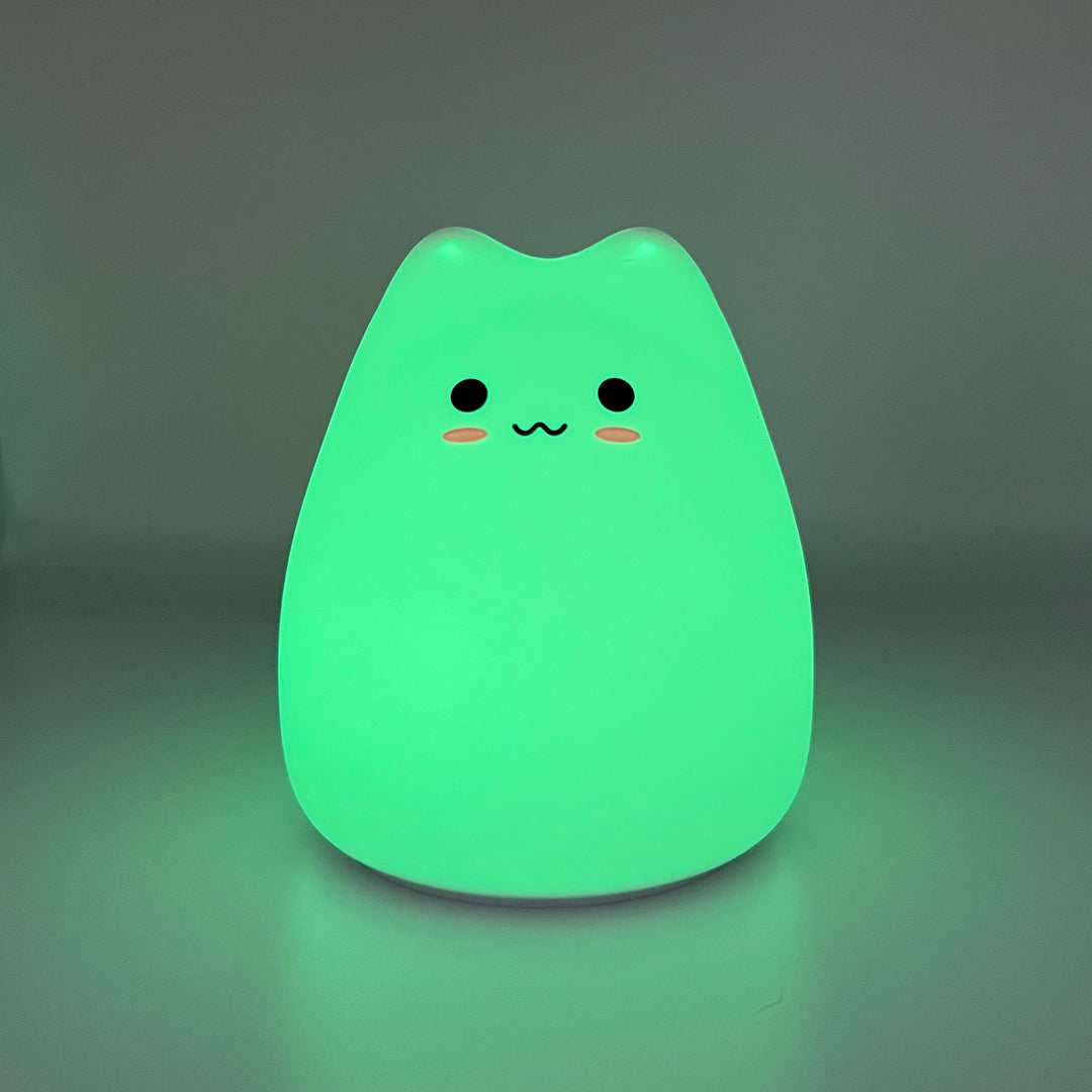 Silicone cat night light glowing green