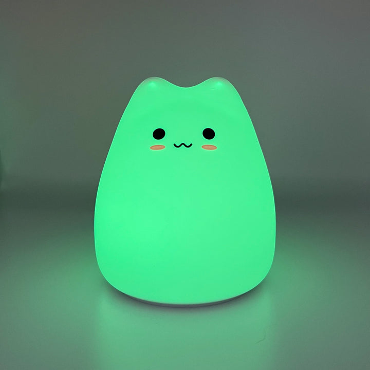 Silicone cat night light glowing green
