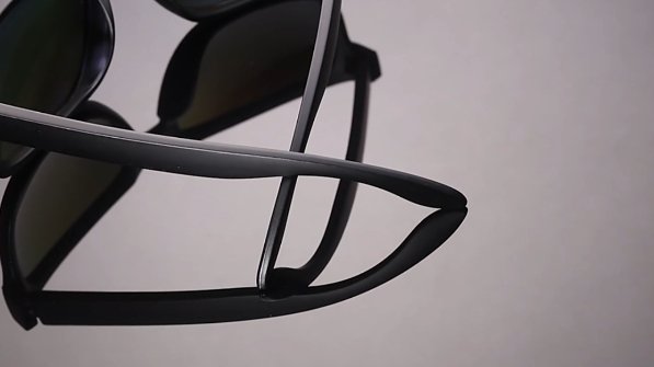 Side profile showcasing the curve of black frame polarized sunglasses - Curated by HikeWare.